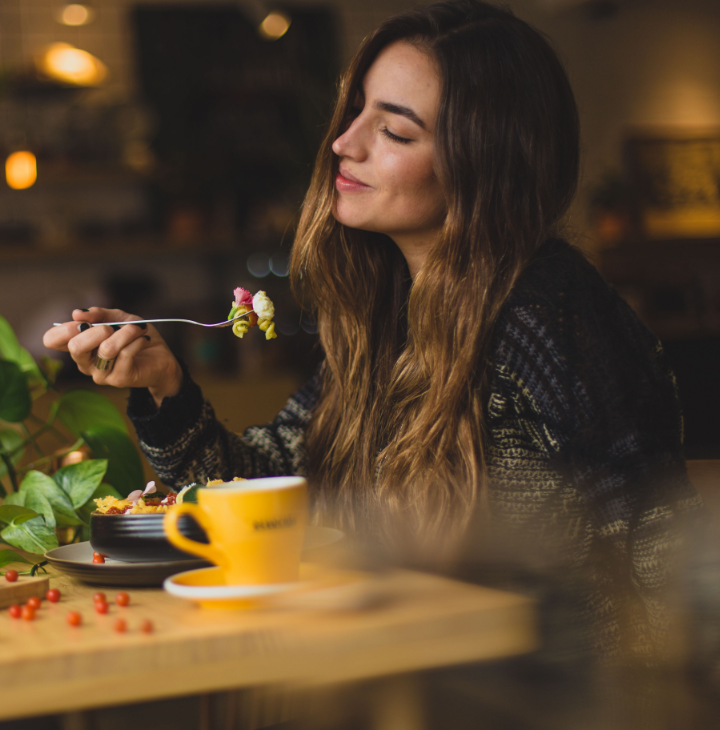 Image of a woman enjoying food